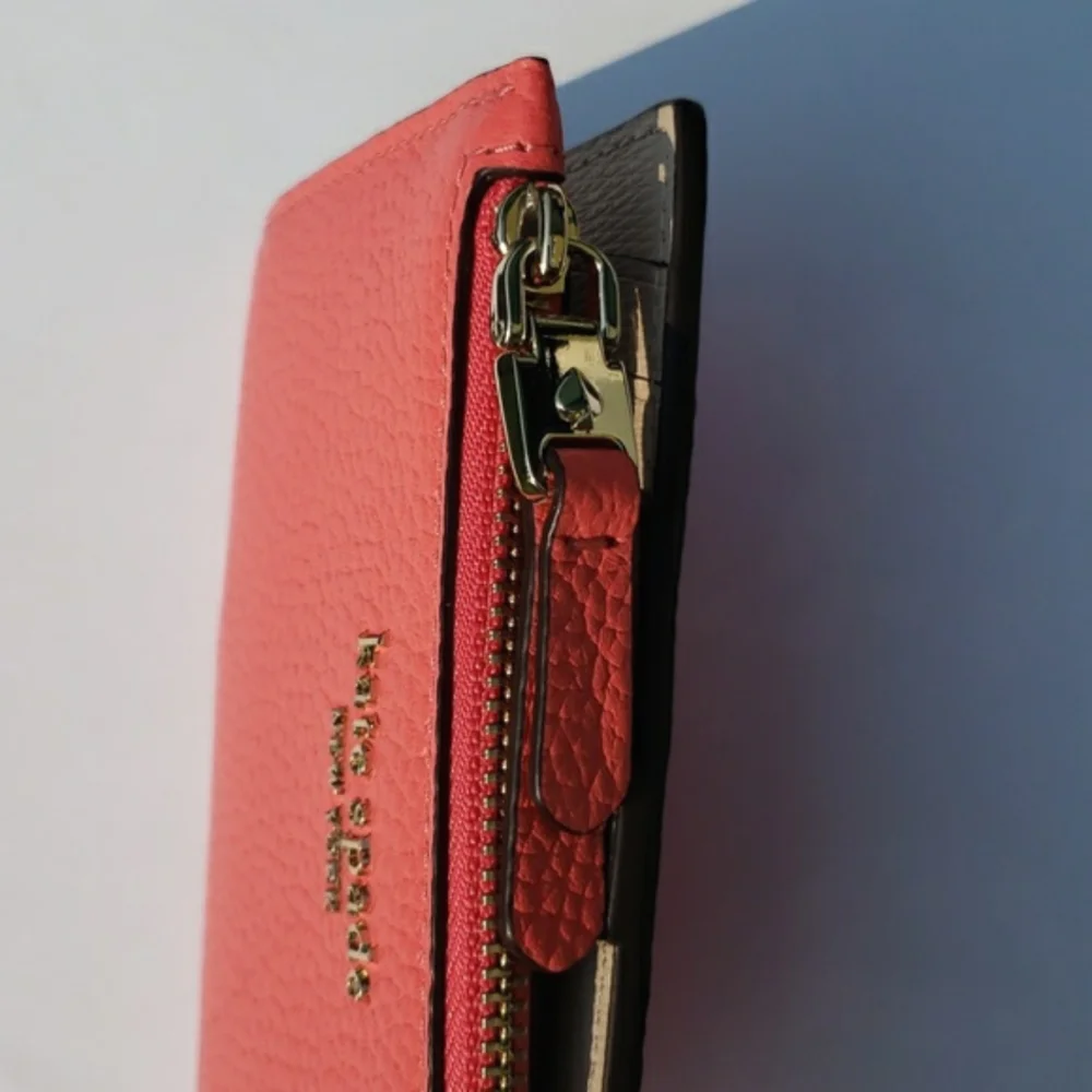 Kate Spade Leather Roulette Small Slim Bifold Wallet. Color: Peachmelba.